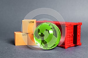 Red cargo container with boxes and green planet earth glass ball. Business and industry, transport infrastructure.