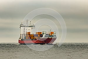 Red cargo container ship