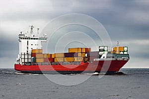 Red cargo container ship