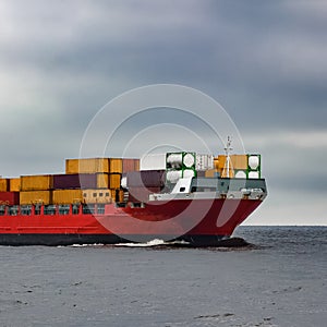 Red cargo container ship