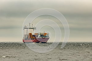 Red cargo container ship