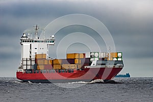 Red cargo container ship