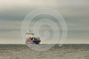 Red cargo container ship