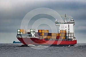 Red cargo container ship