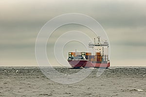 Red cargo container ship