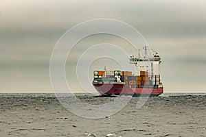 Red cargo container ship