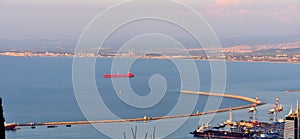 Red cargo ship in Haifa Bay