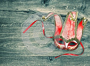Red carnival mask harlequin. Symbol of venetian mask festival