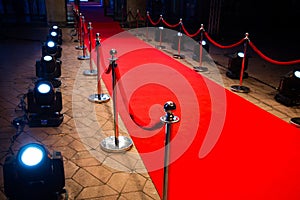 Red carpet with barriers and red ropes