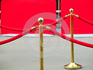 Red carpet entrance with golden stanchions and ropes. Celebrity nominees to premiere. Stars on the festive awarding of prizes