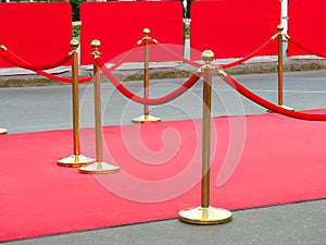 Red carpet entrance with golden stanchions and ropes. Celebrity nominees to premiere. Stars on the festive awarding of prizes photo