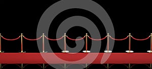 Red carpet with rope barrier on black background