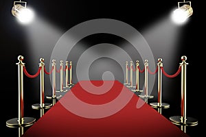 Red carpet and rope barrier with shining spotlights