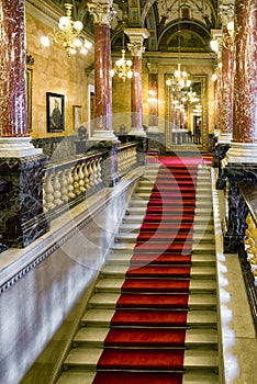 Red carpet on stairs in Hungarian state opera house in Budapest