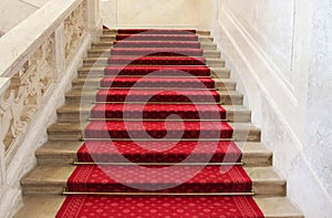 Red carpet on a stairway. Concept or background for richness, fa