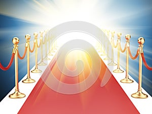 Red carpet between two gold stanchions with rope