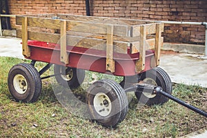 Red cart with wood panel for argriculture