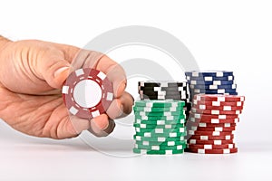 Red casino chip in hand