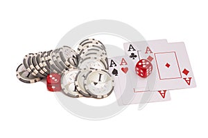 Red casino dice, four aces playing cards and casino chips