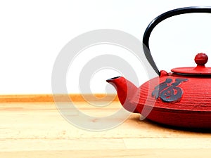 Red cast iron teapot. Copy space.