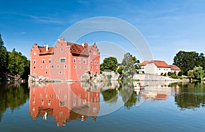 Red castle in the middle of pond