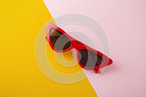 Red cat eye sunglasses on two tone background