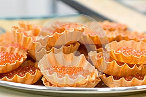 Red caviar in baked shell.
