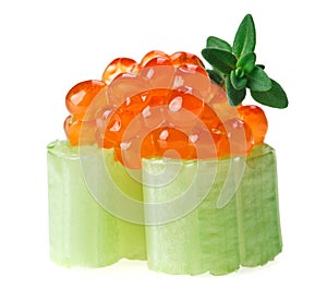 Red caviar canape with celery and thyme twig