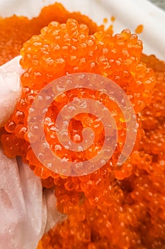 red caviar in plastic container. Salmon caviar, diet food