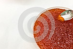 red caviar in plastic container. Salmon caviar, diet food