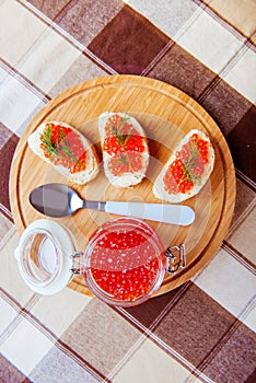 Red caviar sandwiches on plate