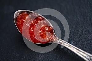 Red caviar in a silver spoon