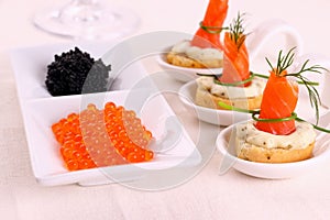 Red caviar and smoked salmon rolls