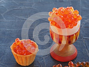 Red caviar in a tartlet and in a stand