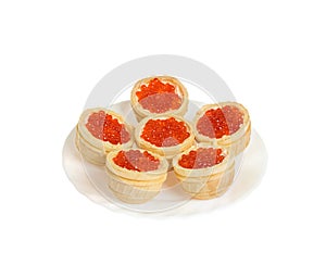 Red caviar in tartlets. Isolated