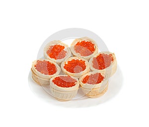 Red caviar in tartlets, isolated on white