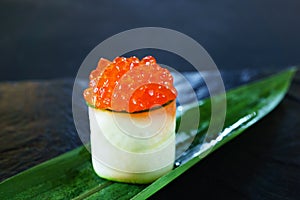 Red caviar topped sushi roll with cream cheese