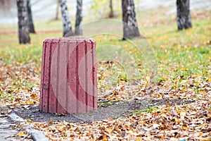 Red Cement Trash Bin in the Park