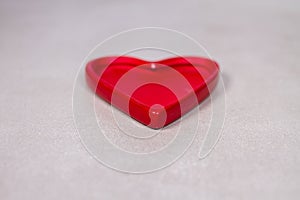 Red Ceramic Heart Figurine on Gray Grey Marble Slate Background