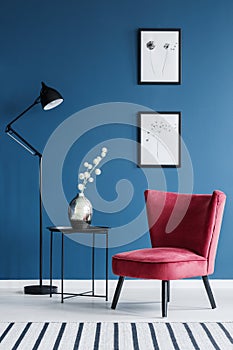 Red chair in blue interior