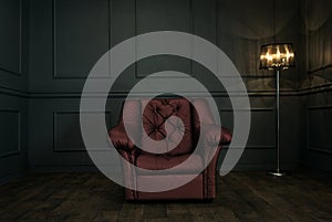 Red chair in elegant dark room