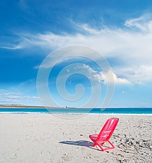 Red chair by the sea