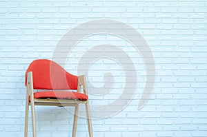 Red chair on white brick background,Modern room,copy space