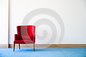 Red chair in white interior