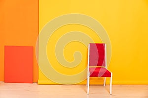 red chair on yellow background interior