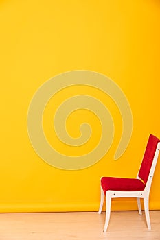 red chair on yellow background interior furniture minimalism