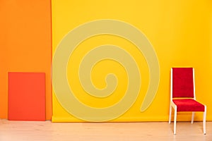 red chair on a yellow background interior in the room