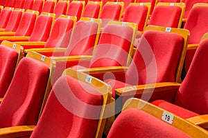 Red chairs in the auditorium of the theater or concert hall