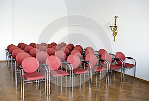 Red chairs in meeting room