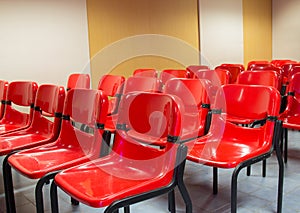 Red chairs in the meeting room.